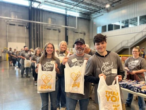 The Alumni Association of College of the Ozarks hosted its annual service day, named in honor of former president Dr. R. M. Good, on Saturday, May 3, at Convoy of Hope in Springfield, Missouri. Pictured (left to right): Shae Lovelace, alumna; Michael Crews, alumnus; and Beau Crews, son of Michael Crews.